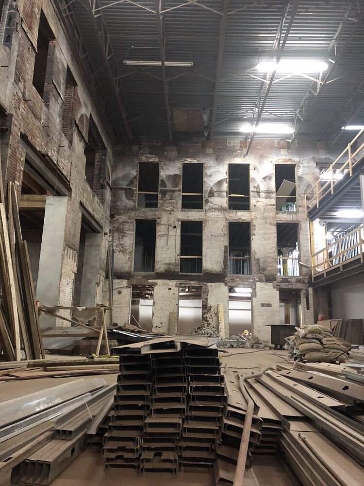 The atrium under construction at Billy Penn Studios, with steel stacked on the floor