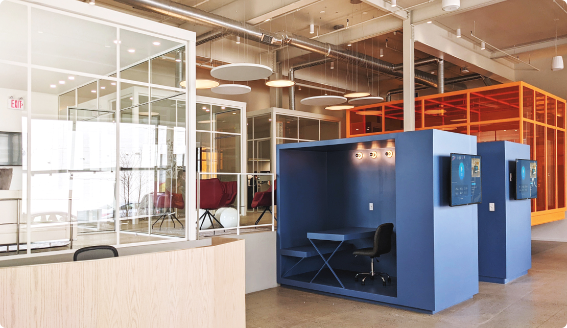 A finished tenant fit out at Billy Penn Studios, with work pods and glass walled meeting rooms