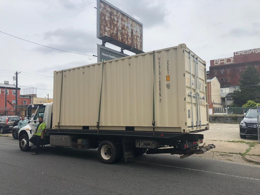 The shipping container being cut and customized to become the café at Billy Penn Studios