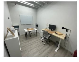 An example two person private office at Billy Penn Studios, with a standing desk, task chair, whiteboard and exposed black joists overhead