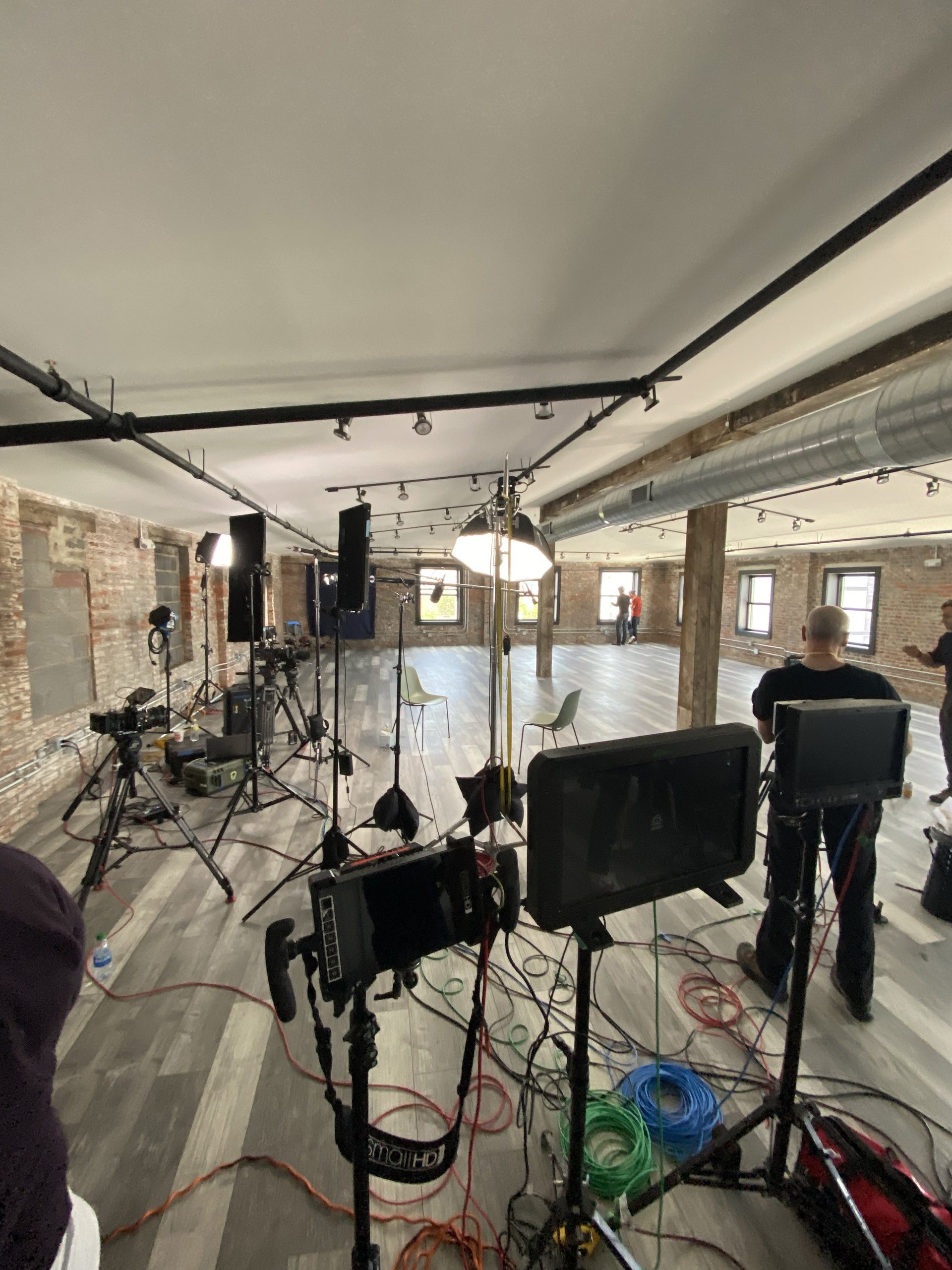 Historic brick and wood beam production space at Billy Penn Studios, Philadelphia