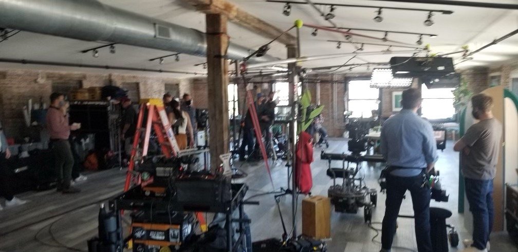 Filming in Unit 504 Billy Penn Studios. Corporate filming with set build, historic wood beams and brick production space.
