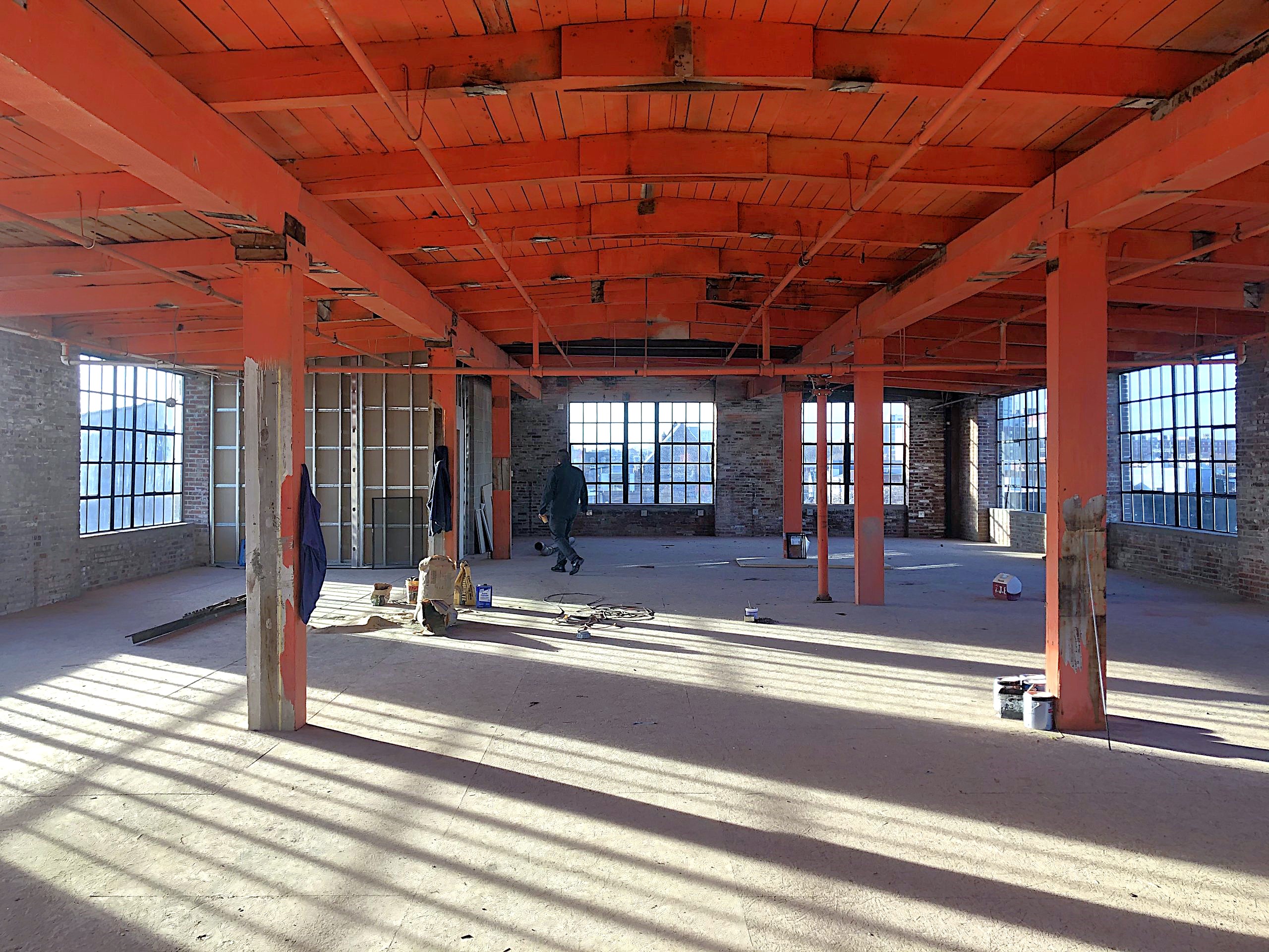 The fifth floor of the lobby building at Billy Penn Studios before construction, with the original timber structure exposed