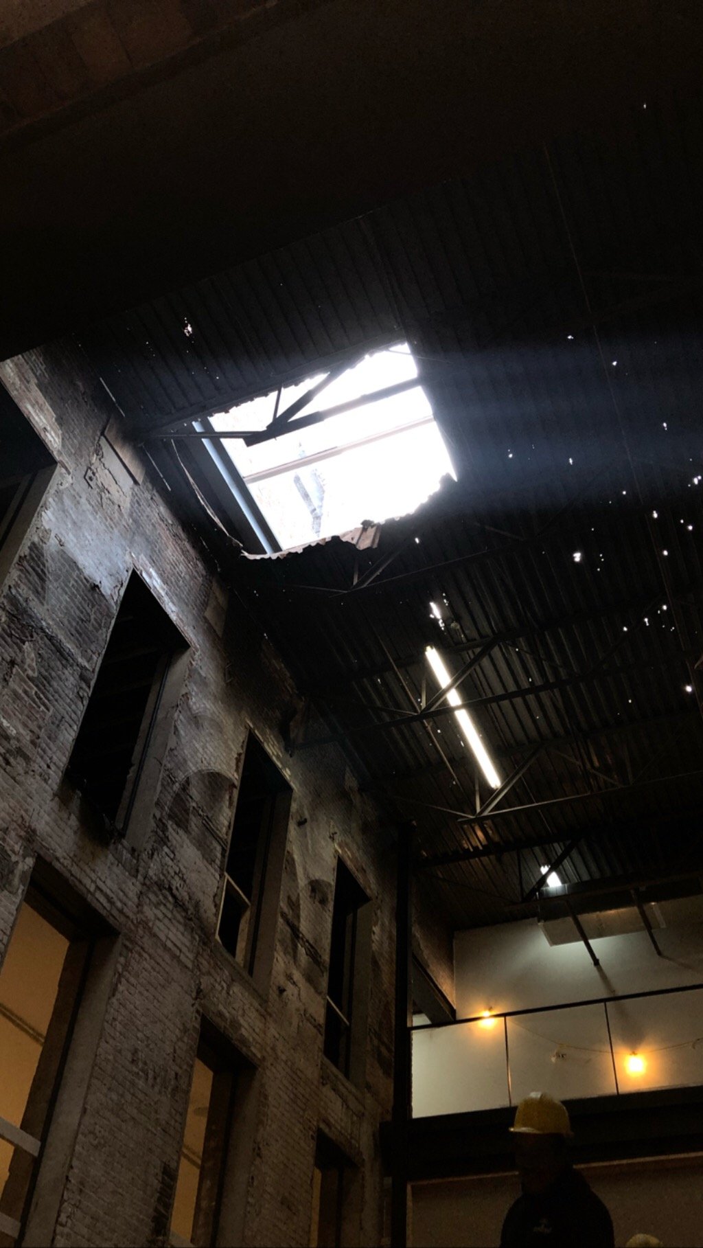 Ceiling removal in the atrium at Billy Penn Studios, opening the space to double height