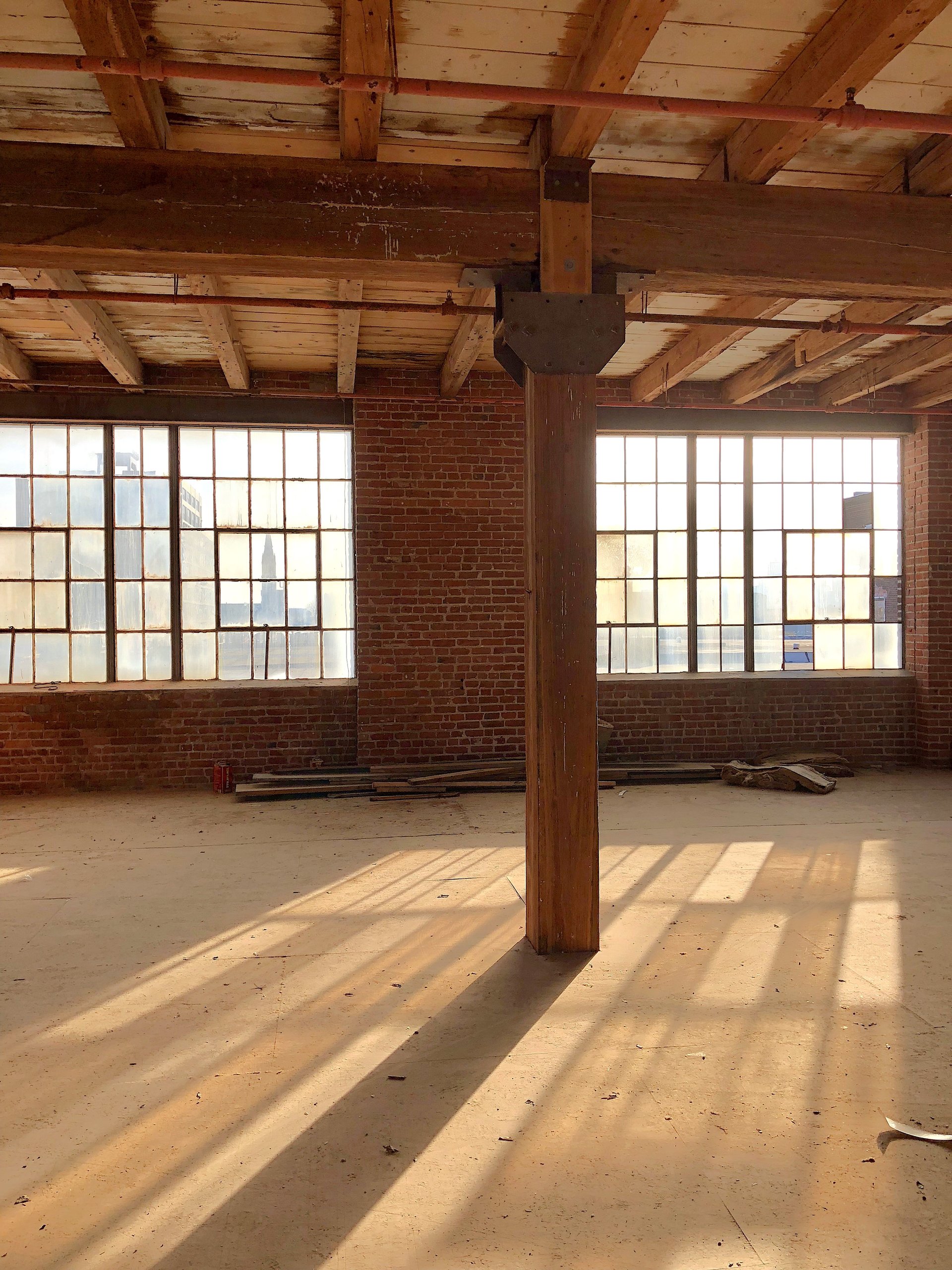 Original factory windows on the fourth floor of the 1922 section at Billy Penn Studios