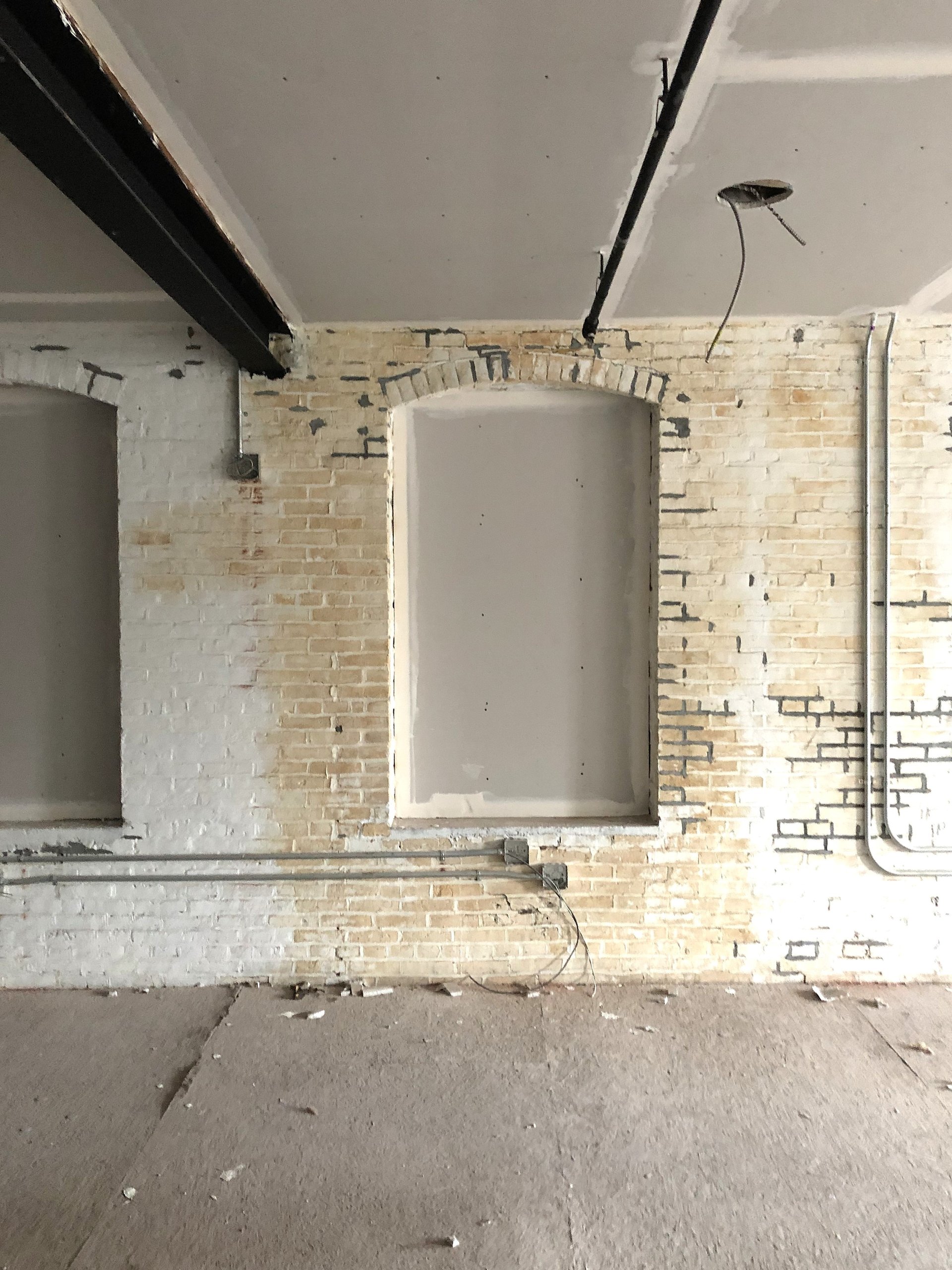 Windows on Building No. 1 at Billy Penn Studios matching the shape recorded in the 1878 Hexamer survey